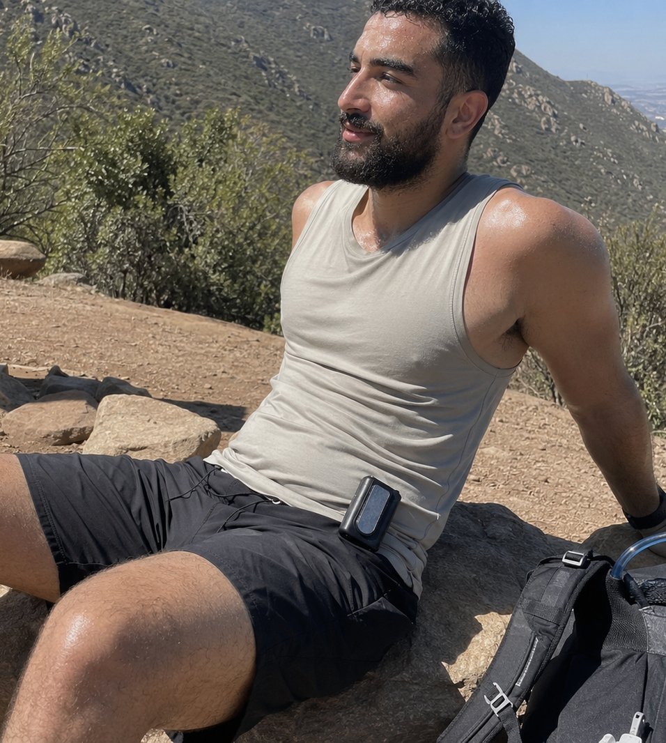 Man wearing the Arctic Clip clipped to his waistband on a hot hike